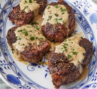 Pinterest graphic of a platter of four steak au poivre with chopped herbs on top of the sauce.