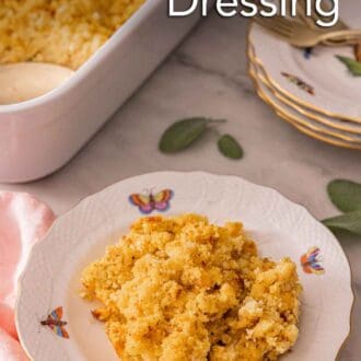 Pinterest graphic of a plate with cornbread dressing in front of a baking dish and a stack of dishes.