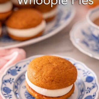 Pinterest graphic of a plate with a pumpkin whoopie pie with more on a platter in the background.