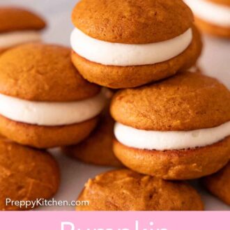 Pinterest graphic of a stack of three pumpkin whoopie pies on top of the baked cookies.