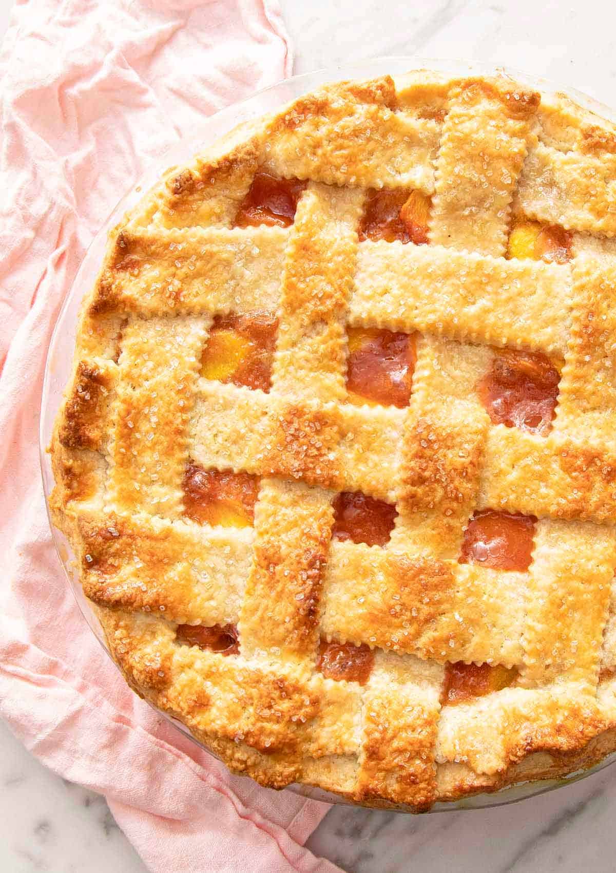 Overhead view of a baked pie with lattice crust.