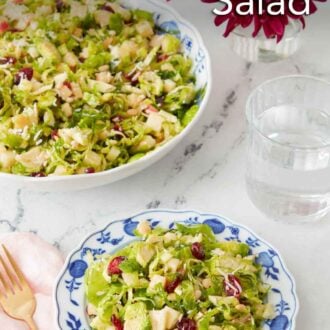 Pinterest graphic of a plate of Brussels sprout salad with a large serving bowl in the background.