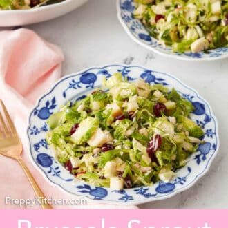 Pinterest graphic of two plates of Brussels sprout salad with a serving bowl in the background.