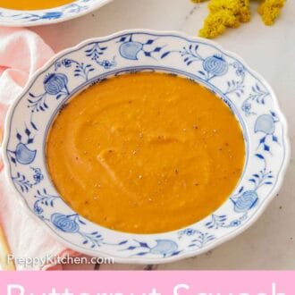 Pinterest graphic of a bowl of butternut squash soup with a second bowl off to the back to the side.