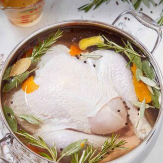 Pinterest graphic of a pot with turkey brine and a turkey inside.