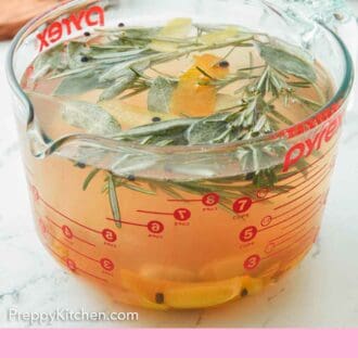 Pinterest graphic of a large measuring cup full of turkey brine.