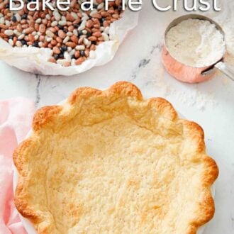 Pinterest graphic of a blind baked crust with some dried beans and a cup of flour in the background.