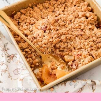 Pinterest graphic of a baking pan of pear crisp with a spoon tucked into it.