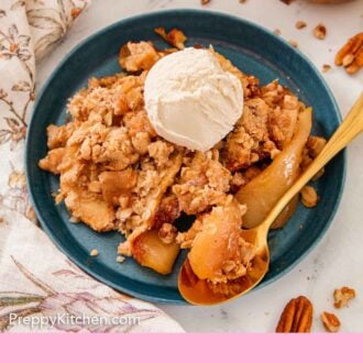 Pinterest graphic of a plate of pear crisp with ice cream on top with a spoon on the plate.