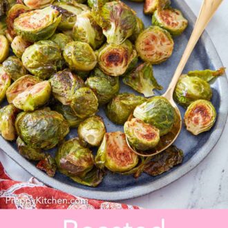 Pinterest graphic of a blue oval platter of roasted Brussels sprouts with a spoonful inside.