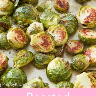 Pinterest graphic of roasted Brussels sprouts on a sheet pan, showing the crispy cut-sides.