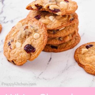 Pinterest graphic of a stack of white chocolate cranberry cookies with one leaned up against it.