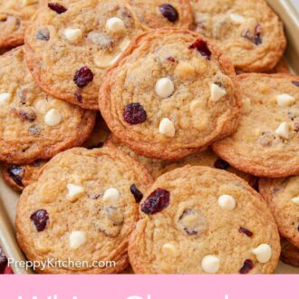 Pinterest graphic of a sheet pan full of white chocolate cranberry cookies.