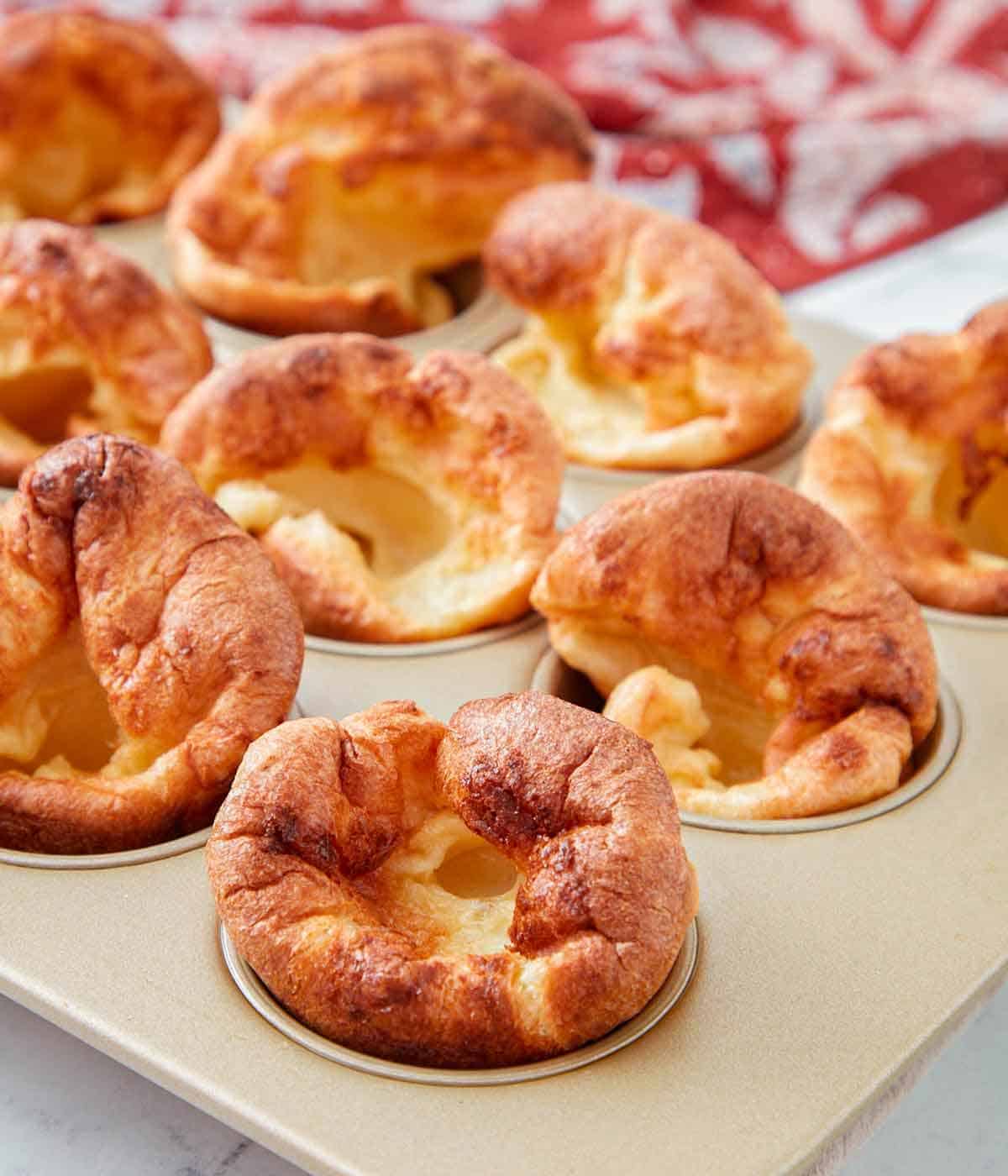 Close up view of Yorkshire pudding in a baking tray.