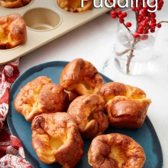 Pinterest graphic of an oval platter of six Yorkshire pudding with more in the background in the muffin tin.