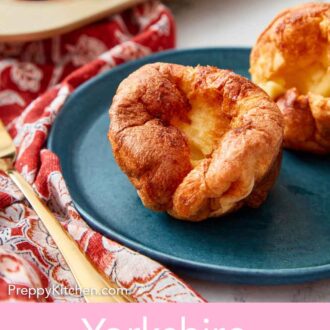 Pinterest graphic of a close view of a Yorkshire pudding on a blue plate.