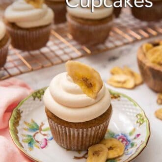 Pinterest graphic of a small plate with a banana cupcake with more in the background on a wire rack.