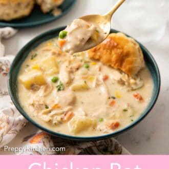Pinterest graphic of a spoonful of chicken pot pie soup lifted from a bowl with additional biscuits in the background.
