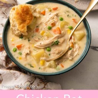 Pinterest graphic of a bowl of chicken pot pie soup with a spoon and biscuit in the soup.