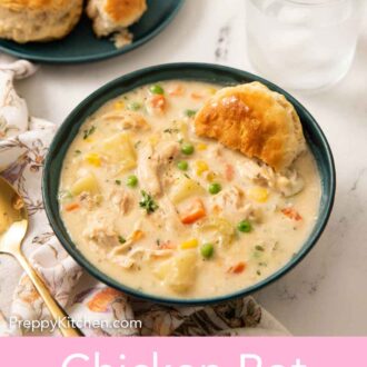 Pinterest graphic of a bowl of chicken pot pie soup with a biscuit tucked into it.