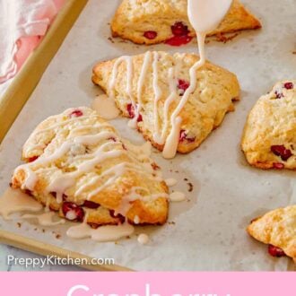 Pinterest graphic of a spoonful of glaze drizzled over the cranberry orange scones on a sheet pan.