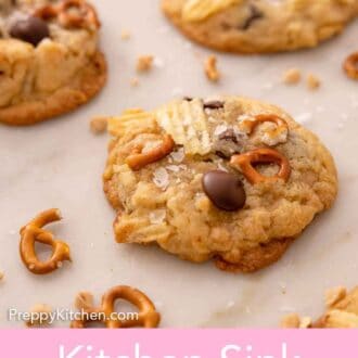 Pinterest graphic of kitchen sink cookies on a marble counter with pretzels scattered around.