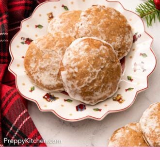 Pinterest graphic of a festive plate with four Lebkuchen cookies.
