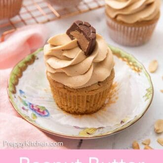 Pinterest graphic of a small plate with a peanut butter cupcake with half a peanut butter chocolate on top of the frosting.