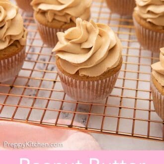 Pinterest graphic of multiple frosted peanut butter cupcakes on a wire cooling rack.
