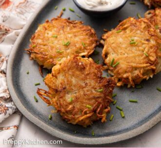 Pinterest graphic of a platter of potato pancakes with a bowl of sour cream and chives scattered on top.