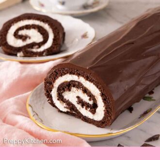 Pinterest graphic of a Swiss roll on a long platter with a piece cut off and plated in the back.