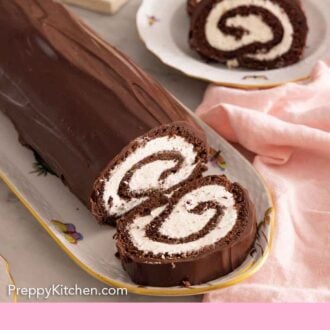 Pinterest graphic of an oval platter with a Swiss roll with one slice in front and two slices plated in the background.
