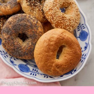 Pinterest graphic of a platter of bagels, all with different toppings.