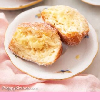 Pinterest graphic of a plate with a bomboloni cut in half, showing the pastry cream in the middle.