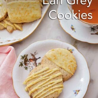 Pinterest graphic of a plate with two browned butter-earl grey cookies by a cup of tea and more cookies on a platter.