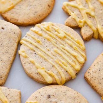 Multiple differently shaped browned butter-earl grey cookies in a single layer.