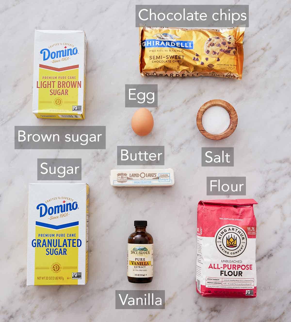 Ingredients needed to make a cookie in a mug.
