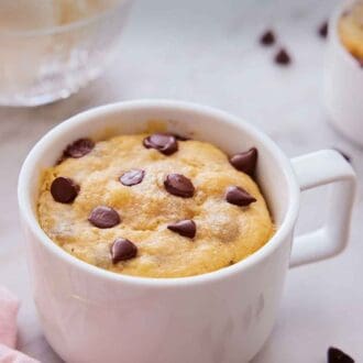 Pinterest graphic of a cookie in a mug with some scoops of ice cream in the background.