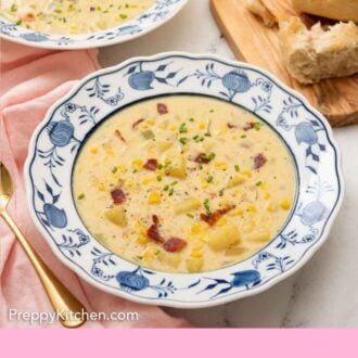 Pinterest graphic of a bowl of corn chowder with a serving board with some bread and a second bowl of chowder in the background.