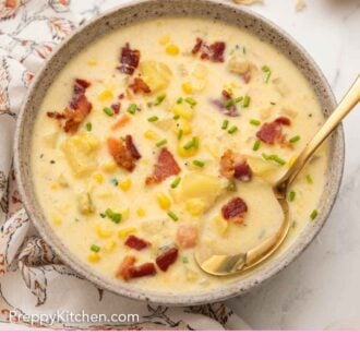 Pinterest graphic of an overhead view of a bowl of corn chowder with a spoon tucked into the chowder.