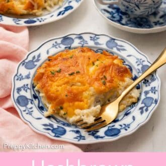 Pinterest graphic of a plate with a serving of hashbrown casserole with a fork. Coffee and a second plate in the background.