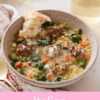 Pinterest graphic of a bowl of Italian wedding soup with grated parmesan and torn bread inside.