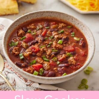 Pinterest graphic of a bowl of slow cooker chili with green onion garnish.