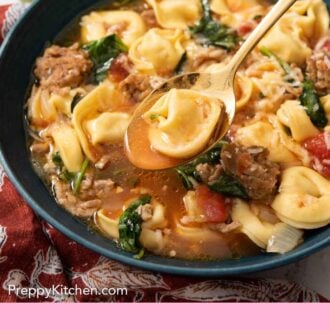Pinterest graphic of a bowl of tortellini soup with a spoonful of soup and a tortellini lifted.