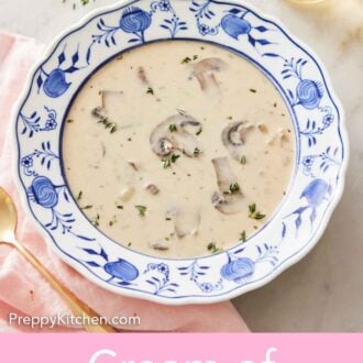 Pinterest graphic of an overhead view of a bowl of cream of mushroom soup with a glass of wine and sprig of fresh thyme in the background.