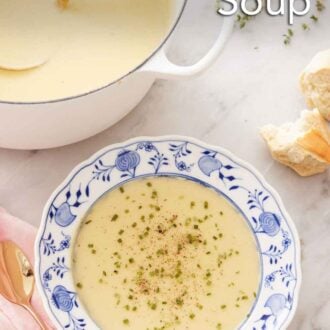 Pinterest graphic of an overhead view of a bowl of potato leek soup in front of a pot of soup with a ladle inside.
