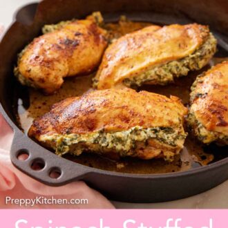 Pinterest graphic of a skillet with four spinach stuffed chicken breasts.