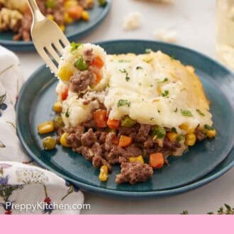 Pinterest graphic of a forkful of shepherd's pie lifted from a plate with a serving on it.