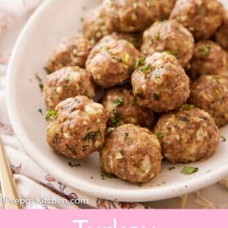 Pinterest graphic of a platter of turkey meatballs with chopped basil on top.