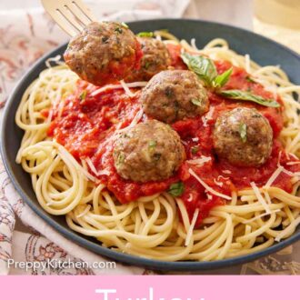 Pinterest graphic of a fork lifting a turkey meatball from a plate of sauce and noodles.